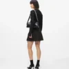 Plisseret miniskirt med bindebånd