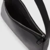 Skinnende skuldertaske med logo