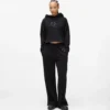Sweatpants med monogram og nitter