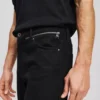 TAPERED JEANS MED LYNLÅS