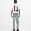 Tapered jeans med malingsstænk