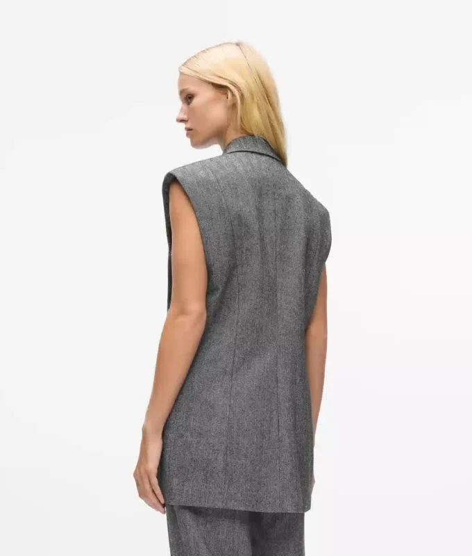 Tweedvest med pailletter på revers